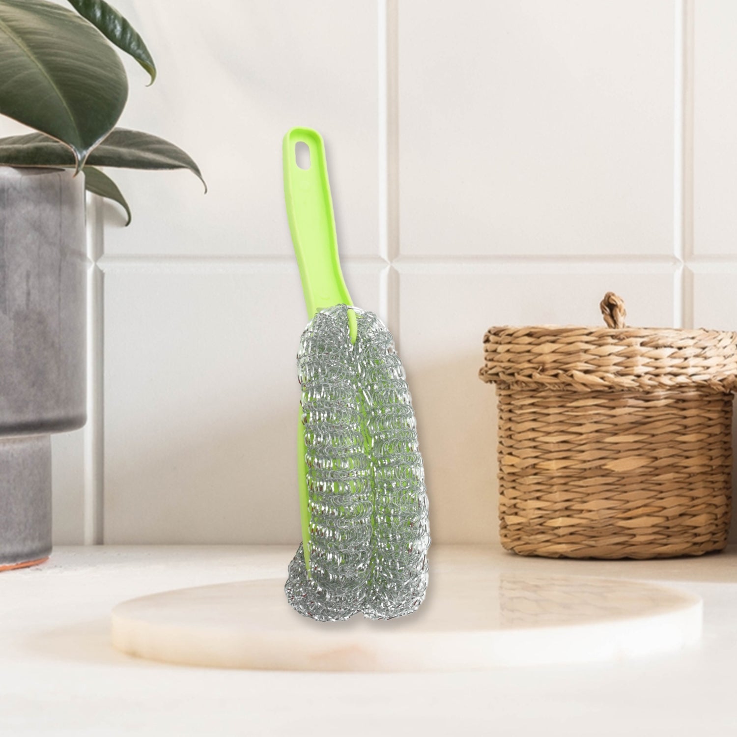 Multi-functional wire brush suitable for various kitchen cleaning tasks.