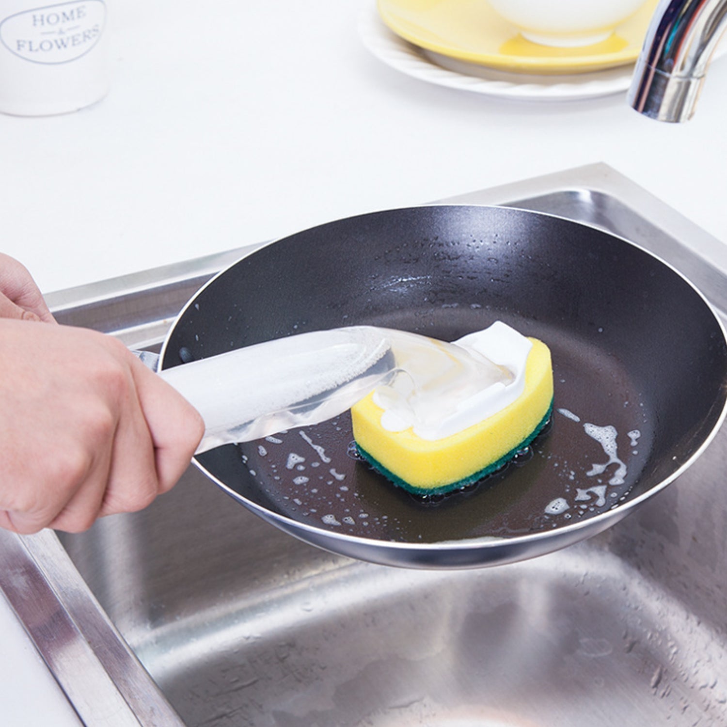 Convenient liquid dispensing scrub for sparkling clean kitchenware