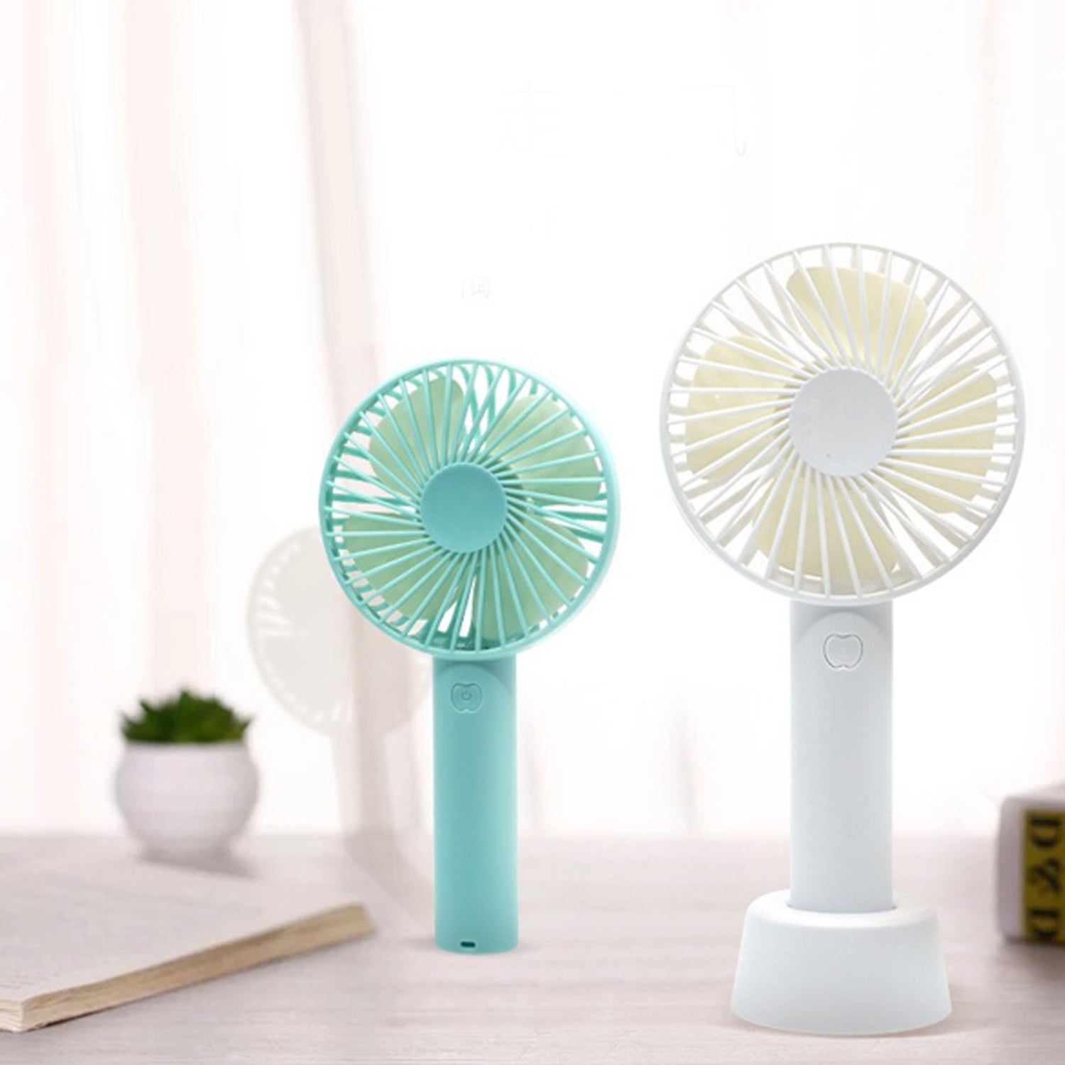 Small portable fan for personal cooling, ideal for summer use (batteries not included).