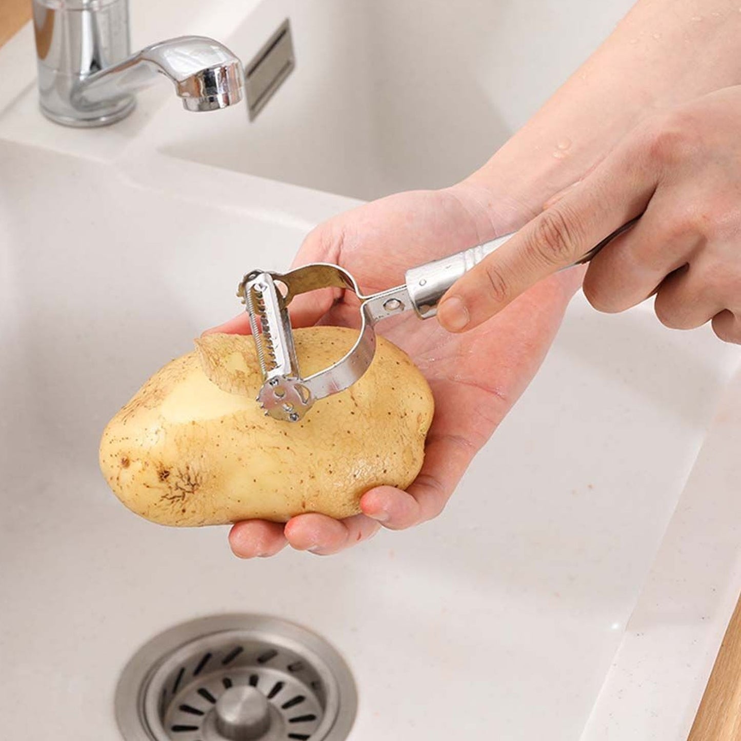 Kitchen tool for peeling and shredding vegetables