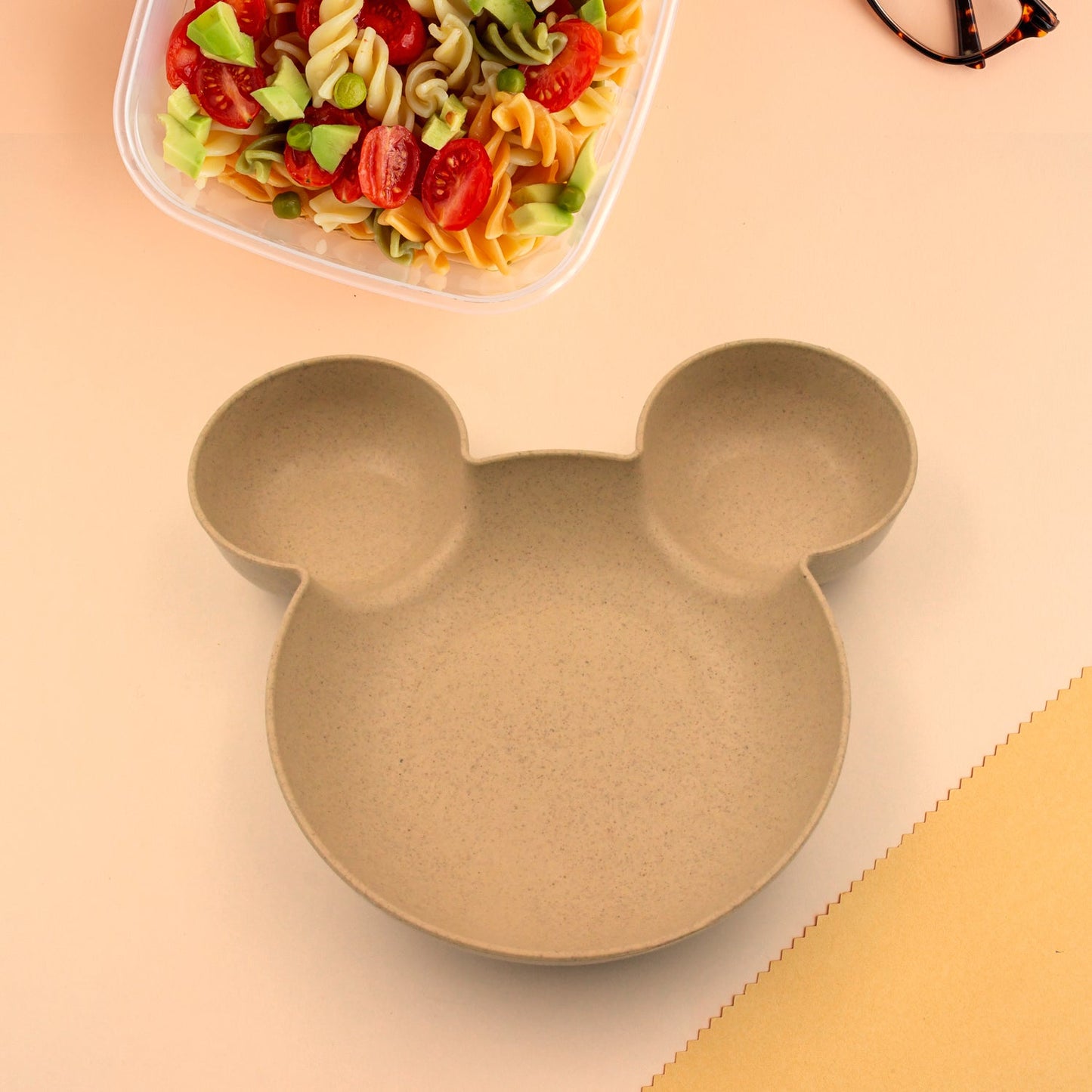 Mickey Mouse-shaped kids' plate, BPA-free and unbreakable.