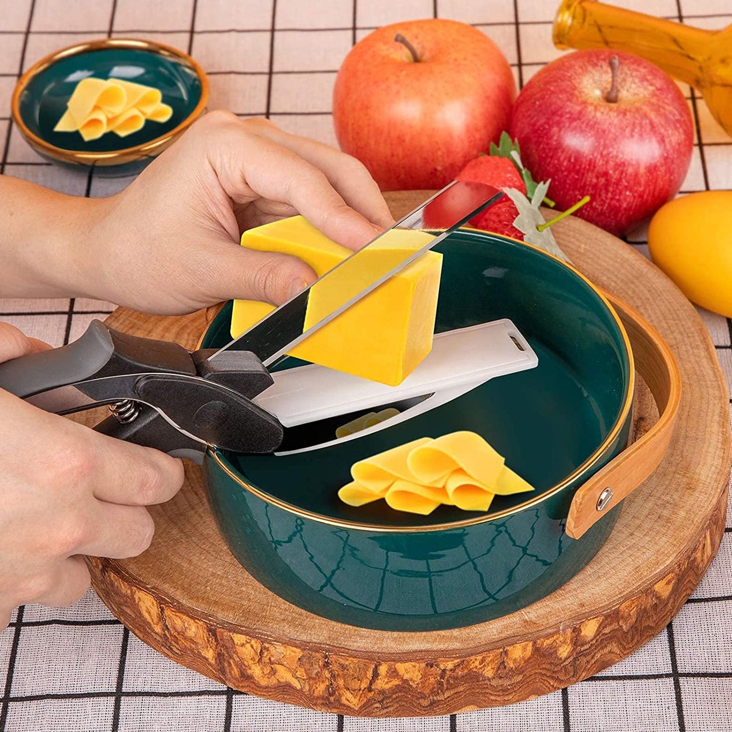 Multi-purpose chopper and slicer for fruits and vegetables with handle.