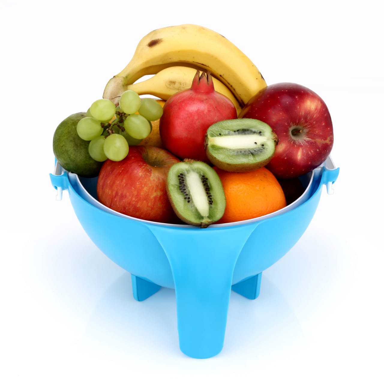 Kitchen tool for cutting and shredding vegetables with drain basket.