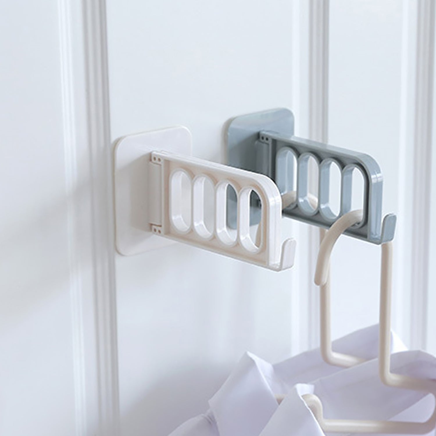 Simple door hook for various uses in bathroom, kitchen, or bedroom.