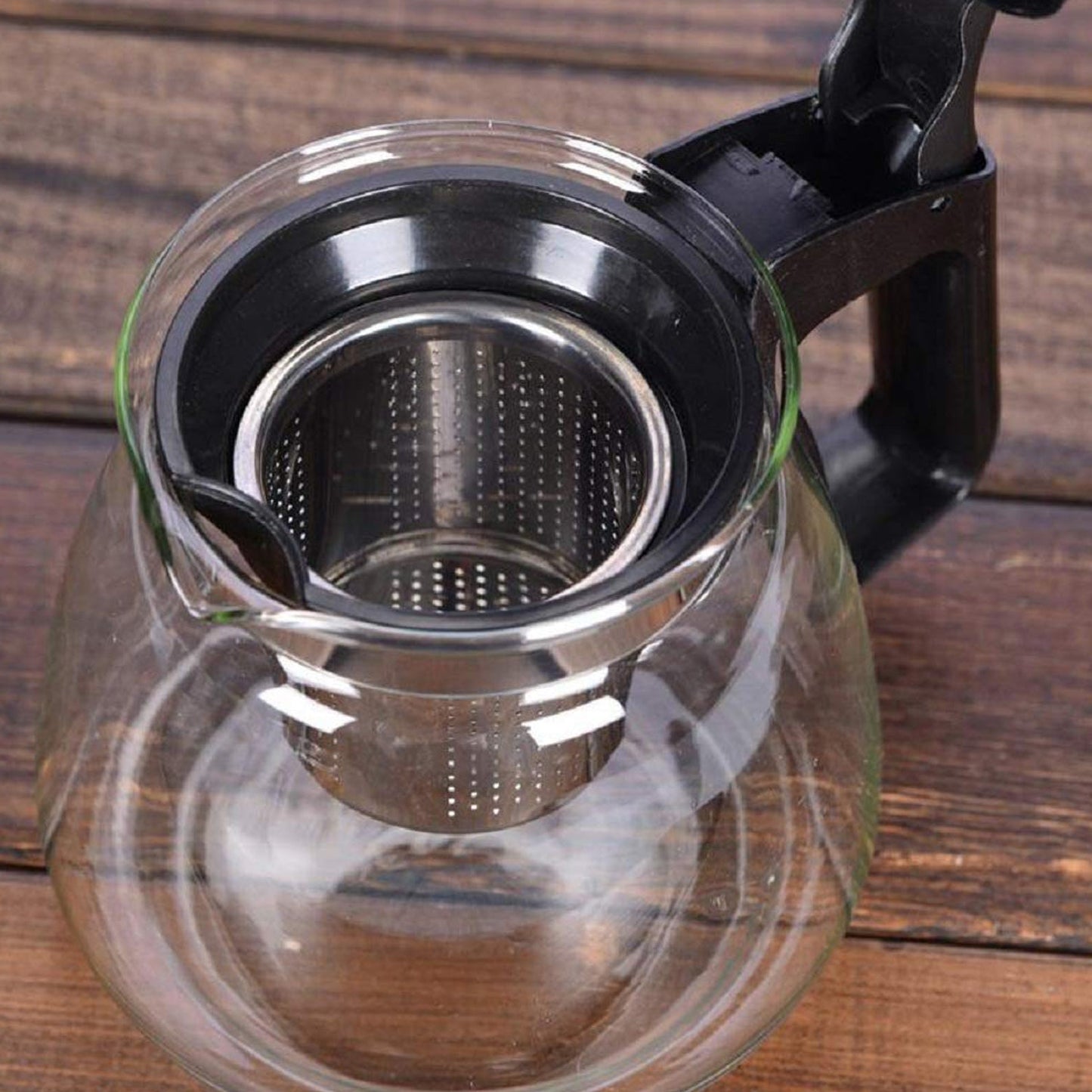 Glass kettle and cups with strainer for serving tea or coffee