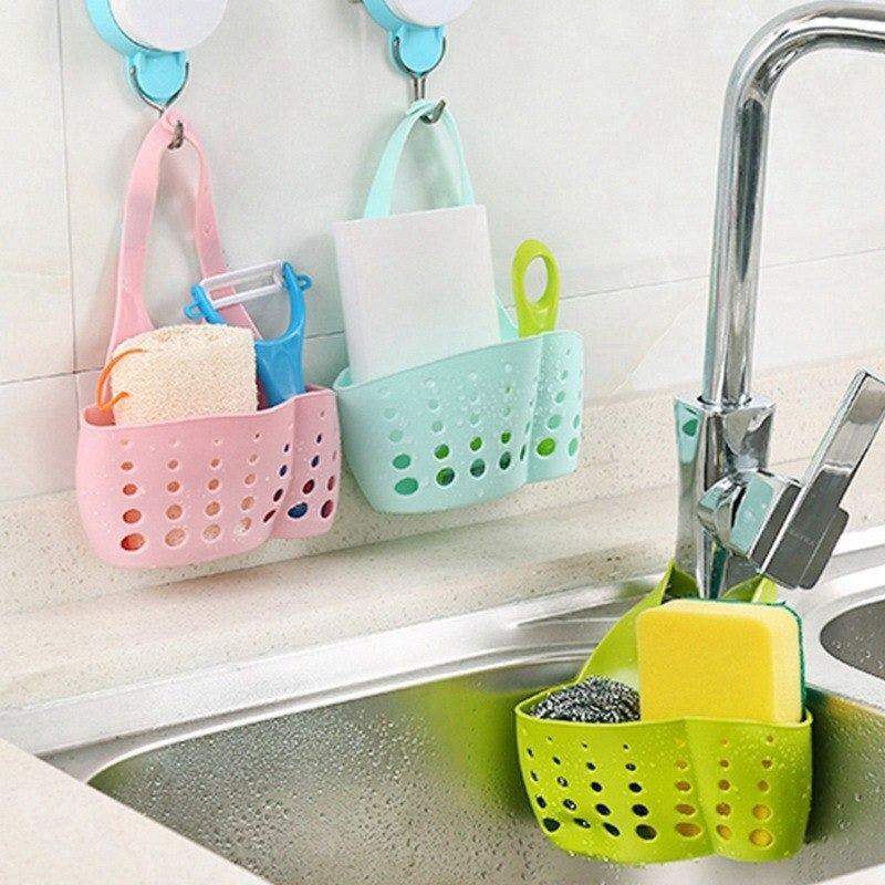 Adjustable plastic basket for kitchen sink, perfect for drainage and organizing small items.