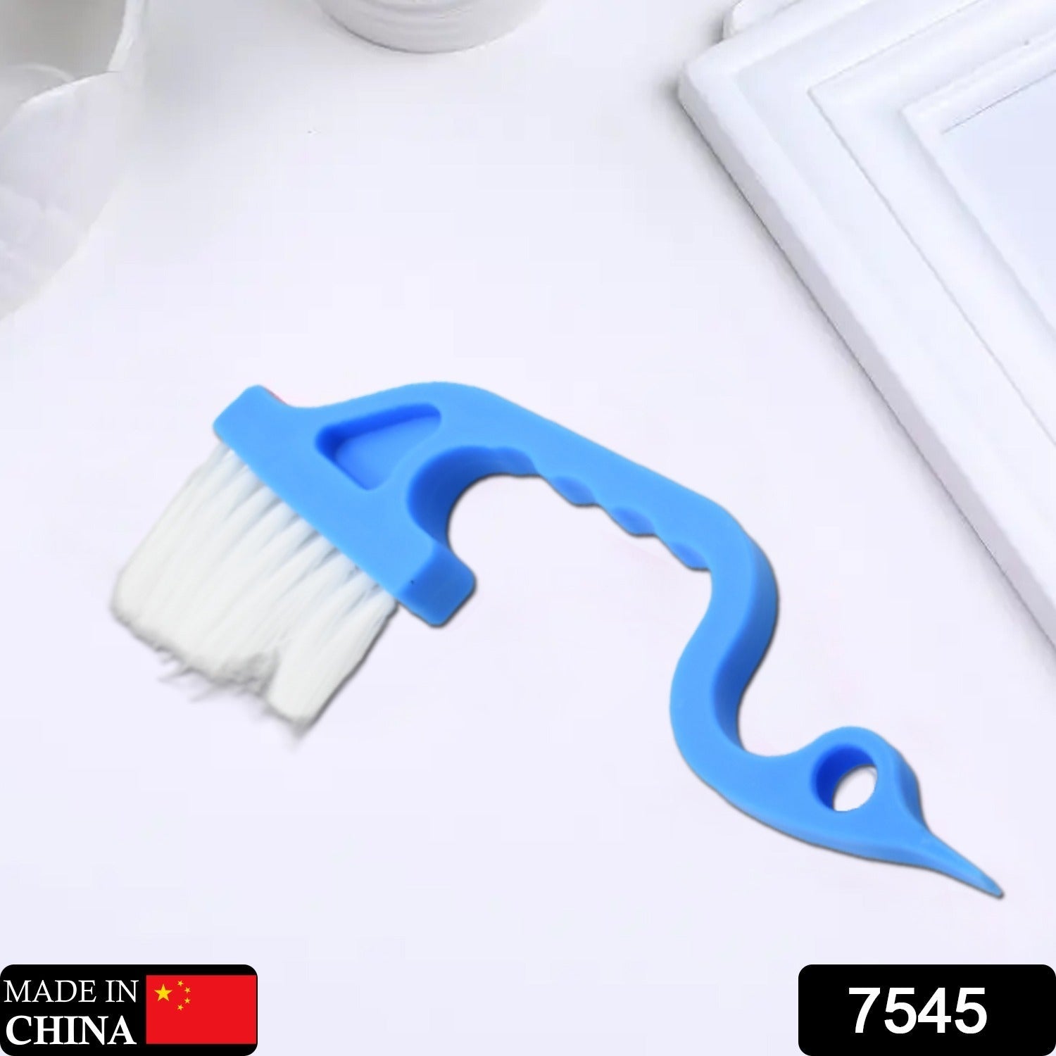 Hand-held brush for cleaning gaps, suitable for windows and keyboards.