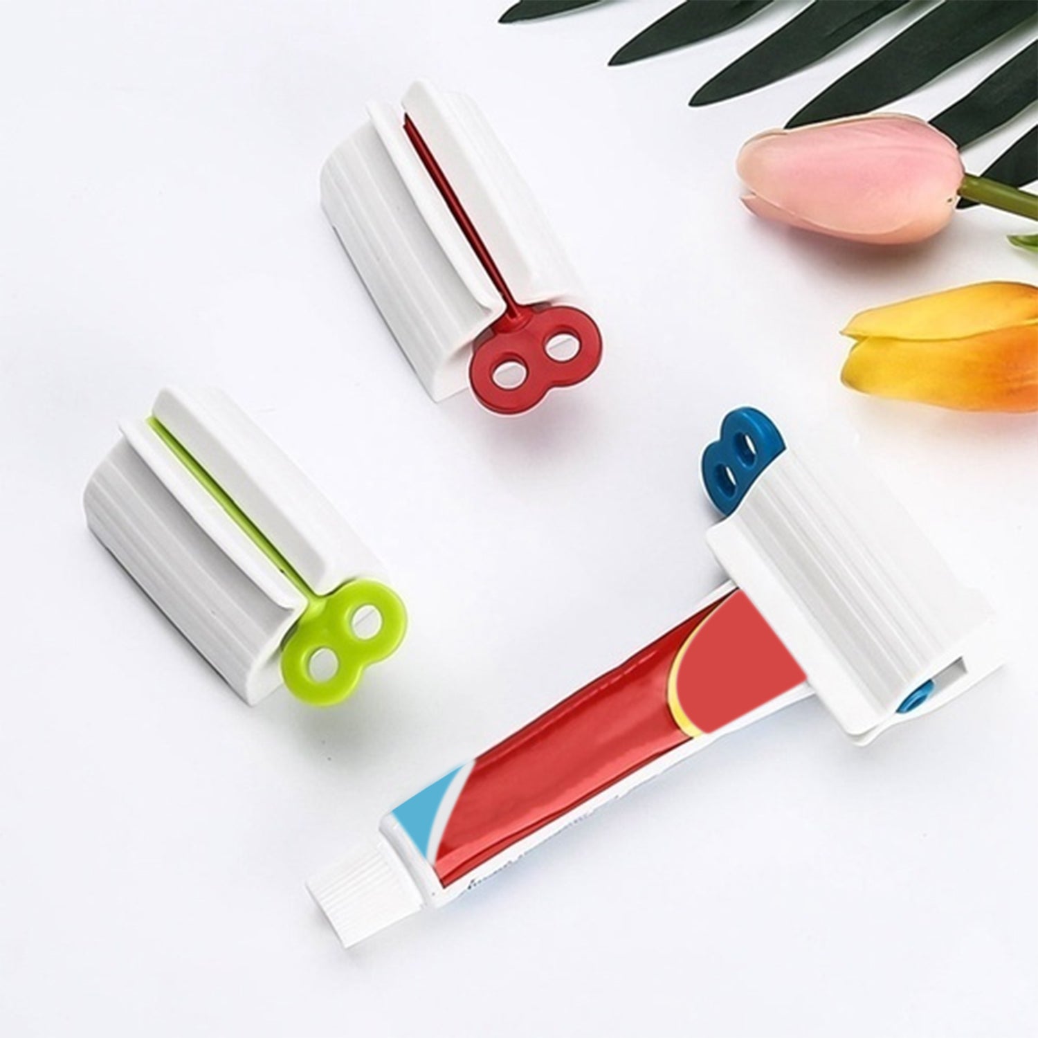 Toothpaste squeezer and holder stand for rolling tubes