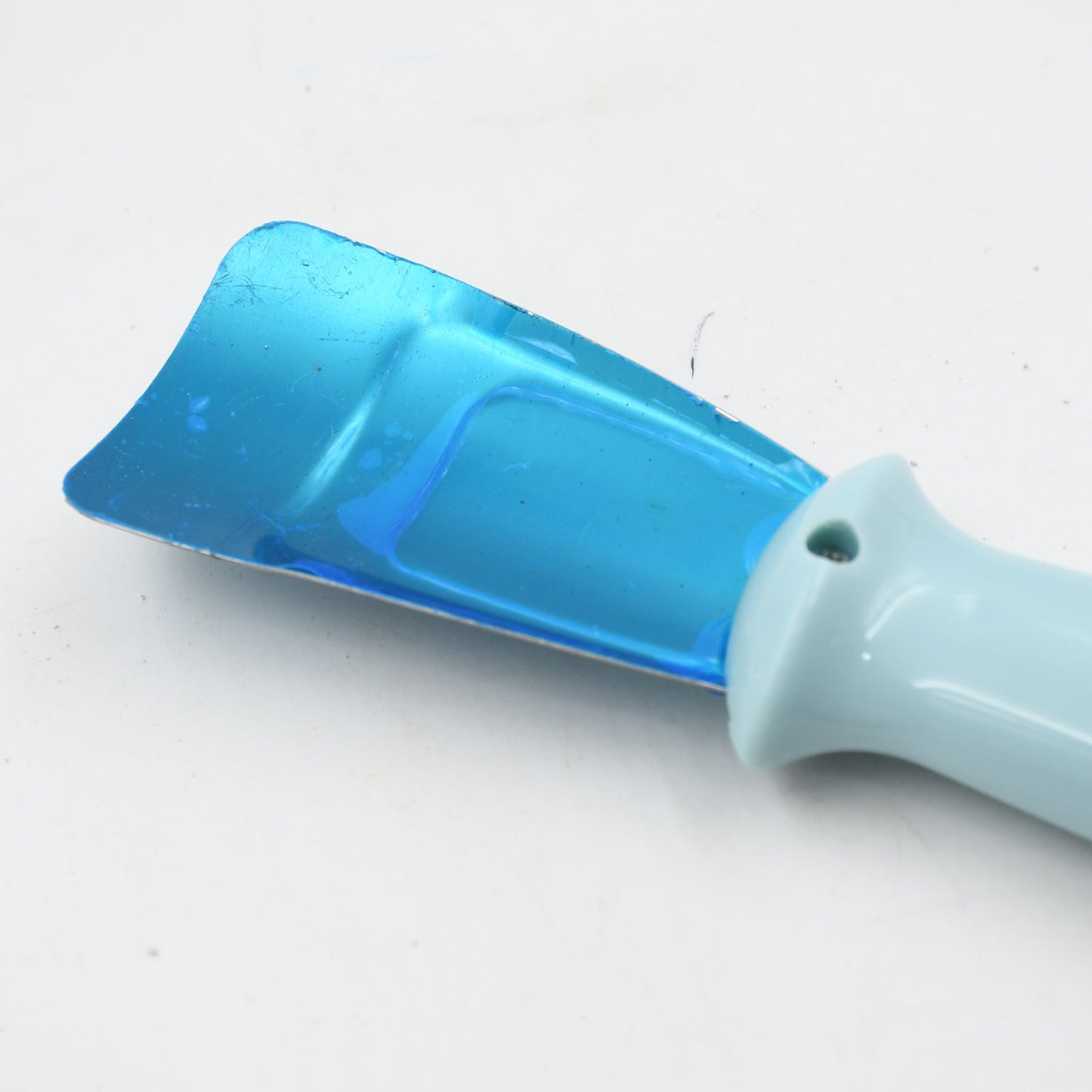 Compact ice scoop with non-slip grip, anti-rust for refrigerator use.