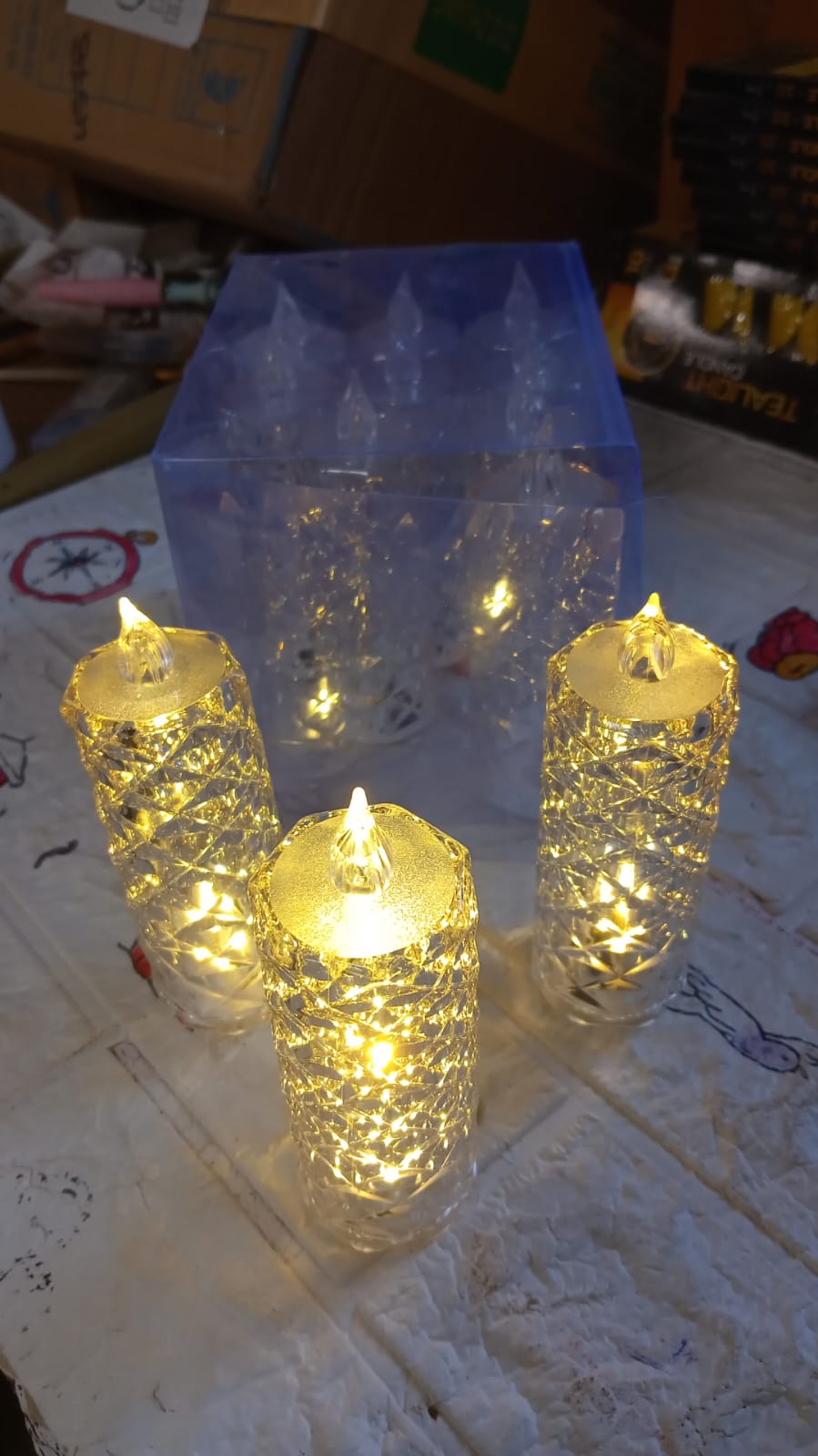 Transparent acrylic rose LED candle with a soft glow, suitable for Christmas and Diwali decor.