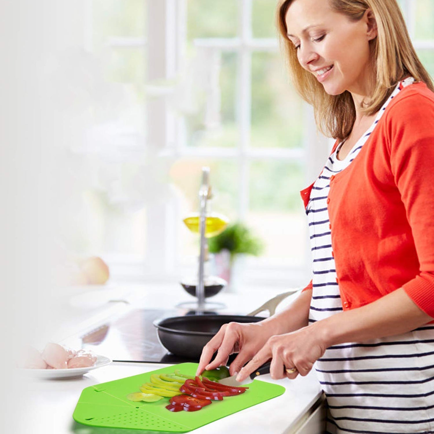 Kitchen chopping board with stand, perfect for various food preparations.