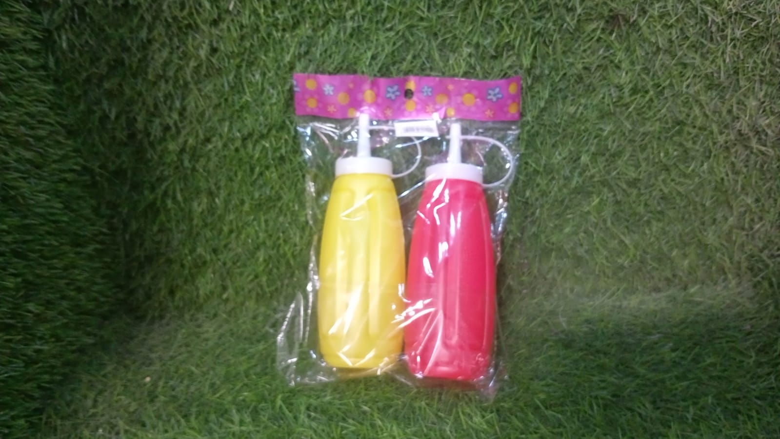 Plastic sauce dispenser bottles, 2-pack, for ketchup, mustard, and honey.