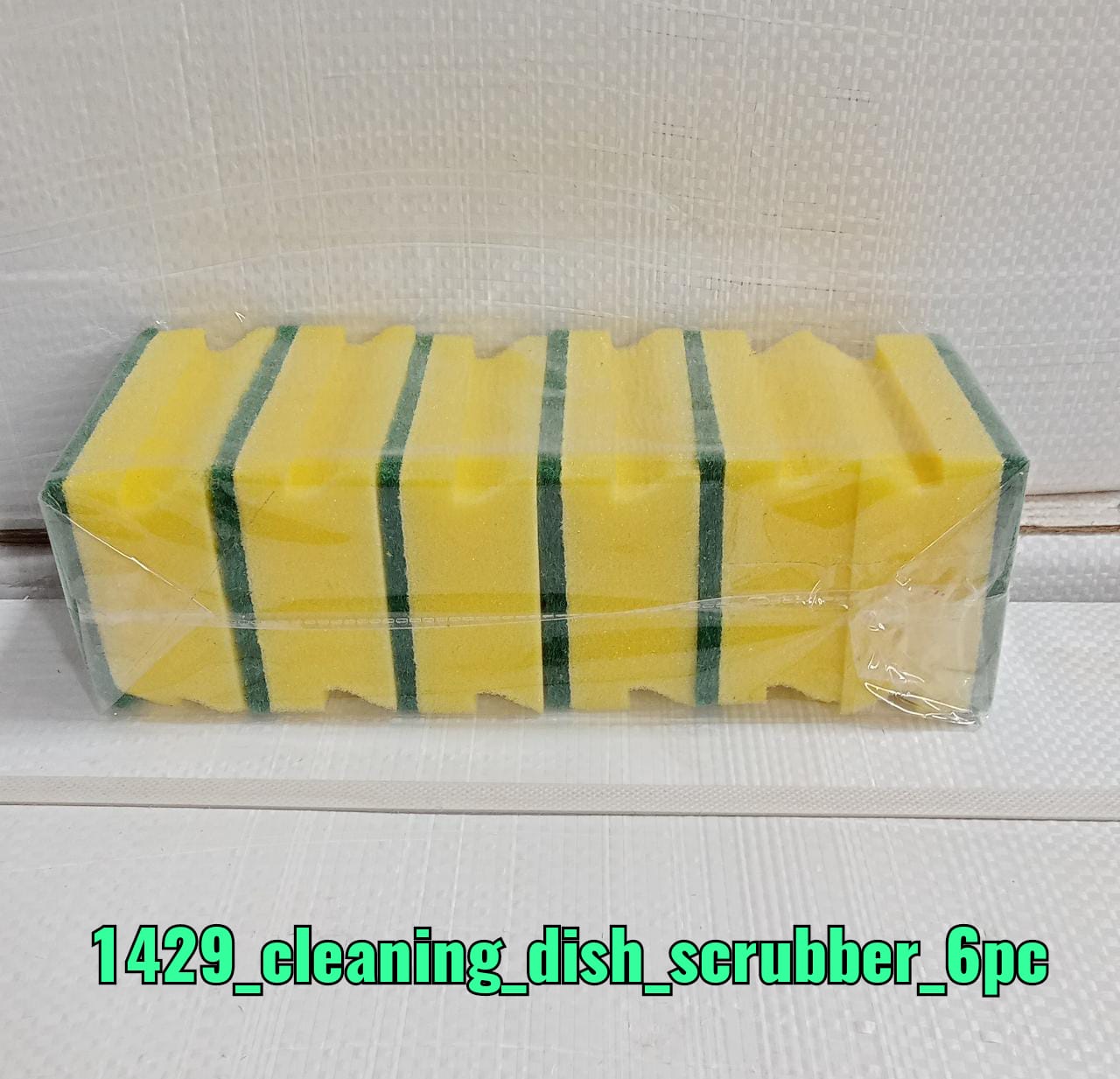 2-in-1 scrub sponge pad, perfect for cleaning kitchen sinks and bathroom surfaces.